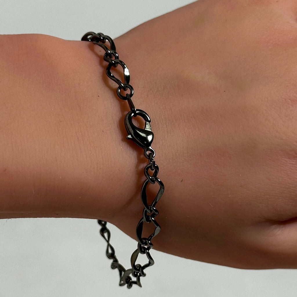 Close-up of the Figaro Style Chain Bracelet in Gunmetal showing detailed links.
