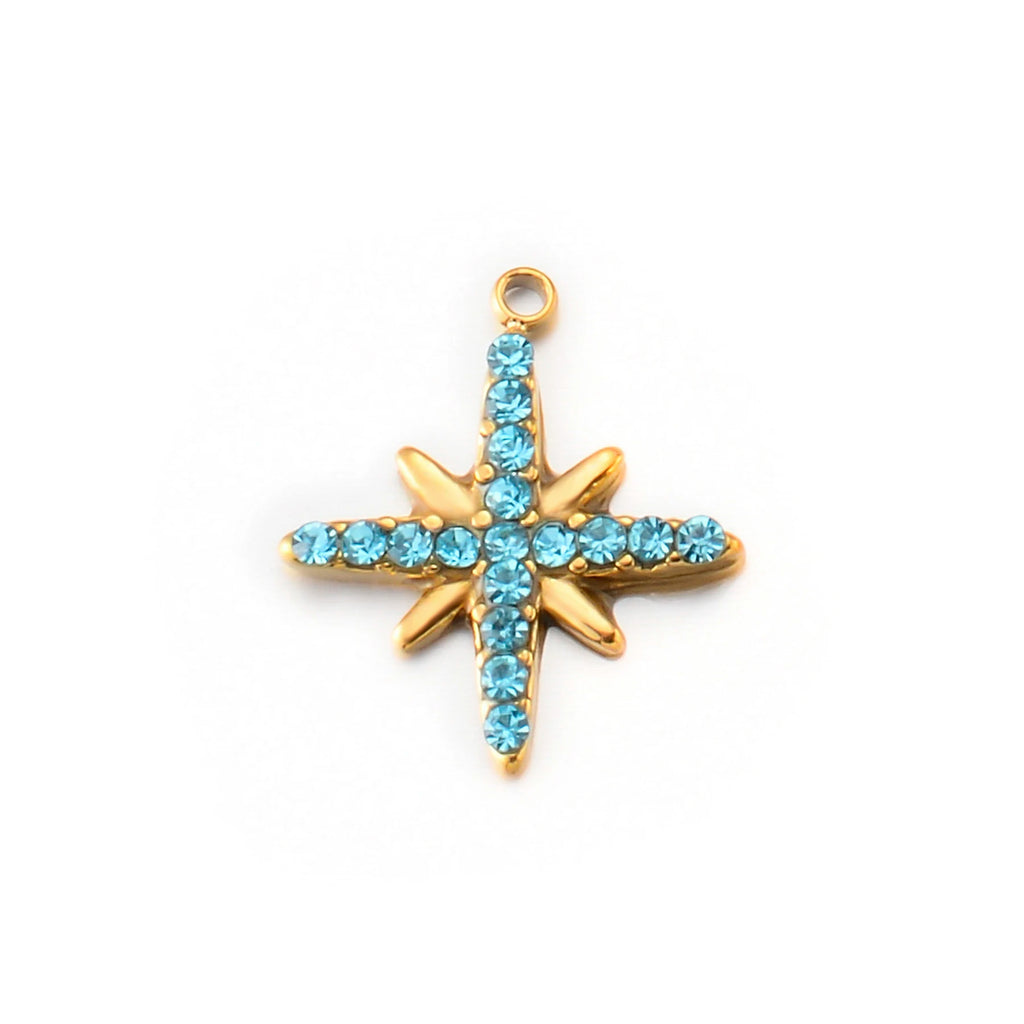 Close-up of starburst charm pendant w/ turquoise rhinestones. A023 Star 2.